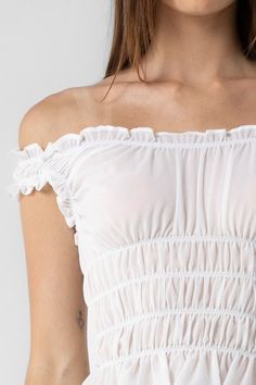 Woven ruffle off the shoulder cropped top. DETAILS• Fabric: 100% POLYESTER Spring Smocked Bodice Bandeau Crop Top, Spring Off-shoulder Smocked Bodice Tube Top, Spring Off-shoulder Tube Top With Smocked Bodice, Off-shoulder Smocked Bodice Tube Top For Spring, Feminine Off-shoulder Top With Ruffles For Summer, Cropped Tube Top With Smocked Bodice, Casual Off-shoulder Ruffled Tube Top, Feminine Ruffled Tube Top, Feminine Ruffled Bandeau Tube Top