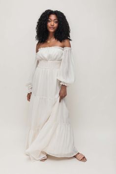 FINAL SALE!Our Fallon Off the Shoulder Maxi features a leg slit, a smocked waistband, and a tiered silhouette. Shell: 100% Polyester Lining: 95% Cotton, 5% Spandex Fully lined Hand Wash Cold Not Eligible for Returns Spanish Style Dress, Bride 2024, Ivory Maxi Dress, Neon Sandals, Lilac Top, White Booties, Maxi Sundress, White Off Shoulder, Senior Pics