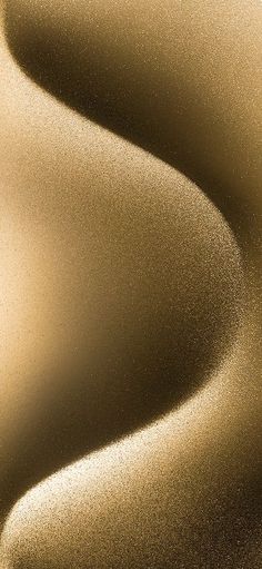 an abstract gold background with smooth lines and curves in the center, as well as some light