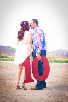 a man and woman standing next to each other with the word love written in front of them