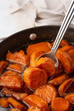 a pan filled with cooked carrots and sauce