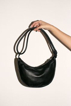 Half moon shaped bag in vegetable tanned semi-aniline cowhide, 100% leather. 11" wide, 7" deep with a 10" strap drop. Doubled, knotted, rolled leather handle and zip closure. Leather Baguette Bag With Round Handle For Everyday, Leather Handheld Baguette Bag With Handle Drop, Soft Leather Satchel With Round Handle, Leather Hobo Bag With Adjustable Strap And Round Handle, Leather Hobo Bag With Removable Pouch And Round Handle, Leather Hobo Bag With Detachable Strap And Round Handle, Corporate Girly, Curated Closet, Market Bags