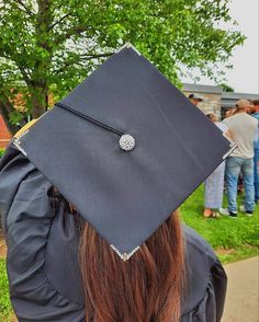 a woman wearing a graduation cap and gown