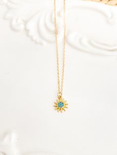 Tiny sun necklace, tiny gold necklace, Turquoise Necklace, dainty necklace, dainty gold necklace, gifts for her ♥This tiny & delicate turquoise and gold sun necklace will be your go to necklace! ♥Wear this necklace alone or layer it with your favorites. ♥A delicate 14k gold filled chain, with a hint of shimmer adorned with a petite turquoise sun charm ♥Pendant measures 9mm x 11mm ♥LENGTH - The sun necklace shown on the model is 18” long. Please choose your desired chain length from the drop down Tiny Gold Necklace, Gold Sun Necklace, Dainty Gold Jewelry, Sun Necklace, Turquoise And Gold, Gold Sun, Dainty Gold Necklace, Necklace Turquoise, Minimal Jewelry