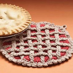 two crocheted pies sitting next to each other