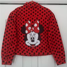 Sale - Disney Minnie Mouse Jean Jacket. So Cute! This Minnie Mouse Jean Jacket Is Absolutely Fantastic And Since It’s A Disney Parks Jean Jacket You Definitely Won’t See Everyone Else Wearing It! The Jacket Is A Button-Down And Also Has Buttons At The Sleeves And Two Buttoned Front Pockets. It’s 100% Organic Cotton So It’s Also Soft And Comfortable. The Minnie Mouse Polka Dot Design Is Super Cute But The Minnie Mouse On The Back Is What Makes This Denim Jacket Even Better! The Jacket Is Mid Weig Disney Long Sleeve Fall Outerwear, Disney Style Long Sleeve Fall Outerwear, Fall Disney Long Sleeve Outerwear, Casual Long Sleeve Mickey Mouse Outerwear, Winter Mickey Mouse Hooded Outerwear, Fall Mickey Mouse Cotton Outerwear, Cotton Mickey Mouse Long Sleeve Outerwear, Minnie Mouse Jean Jacket, Fur Lined Denim Jacket