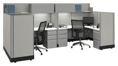 an office cubicle with two desks and chairs