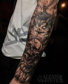 a man's arm with tattoos on it and an image of a wolf in the middle