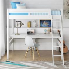 a white loft bed with a desk underneath it and a painting on the wall behind it