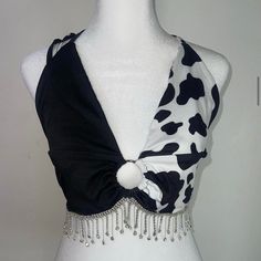 medium/large. Hand wash only! A crop rhinestone fringe cow print top sounds like a fun and bold statement piece! It combines trendy elements like crop tops and fringe with a playful cow print design. Perfect for standing out at a festival or a night out with friends! Trendy Cow Print Top For Summer, Print Top, Purple Cow, Print Crop Tops, Cow Print, Print Tops, Night Out, Cow, Gender Neutral