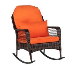 a rocking chair with an orange cushion on it's back and armrests