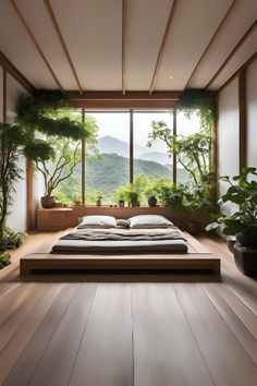 a large bed sitting in the middle of a room with lots of plants on it