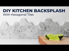 a kitchen backsplash with hexagonal tiles and limes on the cutting board