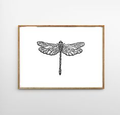 a black and white drawing of a dragonfly sitting on top of a wooden frame