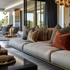 a living room filled with lots of couches and pillows on top of each other