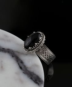 Black Onyx Silver Gothic Oval Statement Ring, 925 Sterling Artisan Made Jewelry Handcrafted Filigree Goth Cocktail Ring, Handmade Jewelry, black stone ring, silver boho dainty ring, gothic jewelry, silver boho ring Material: 925 Sterling Silver ( NICKEL FREE ) Gemstone: Amethyst 10x14 mm. FREE, FAST AND TRACKABLE SHIPPING FOR ALL EU COUNTRIES AND USA. -That ring is so stunning and dainty. Perfect for everyday wear. There is a gorgeous small Flower on the band of the ring and Amethyst Gemstone that dainty. This purple stone ring is made from our finest silver so they are durable for your everyday wear. COMES WİTH VELVET POUCH AND LUXURY GİFT BOX. Makes a great gift: Beautiful jewelry to give for every occasion. The perfect present  for mom , sister, daughter , granddaughter , grandmother , Handmade Black Gothic Rings, Handmade Gothic Black Rings, Gothic Sterling Silver Oval Jewelry, Ornate Black Sterling Silver Rings, Victorian Black Sterling Silver Rings, Victorian Style Black Sterling Silver Rings, Ornate Black Rings As Gift, Ornate Black Rings For Gifts, Ornate Black Rings For Gift