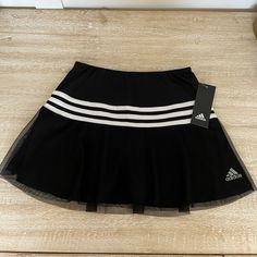 This Tennis Skirt Gets Some Style With A Mesh Overlay And The Iconic Adidas Stripe Adidas Skirt Outfit, Adidas Mini Skirt, Sporty Black Go-dry Tennis Skirt, Tennis Skirt Png, Slazenger Tennis Skirt, Black Sporty Tennis Skirt With 4-way Stretch, Purple Tennis Skirt, Adidas Tennis Skirt, Girls Tennis Skirt