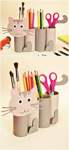 two cups with pencils and pens in them, one has a cat face on it