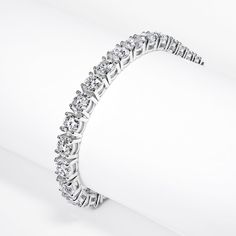 The LAJOIA 28.77 Carat Single Row Lab Grown Diamond Tennis Bracelet features ROUND BRILLIANT CUT DIAMONDS brilliants weighing a total of approximately 28.77 carats, set in 14K White Gold.Style:DiamondsDiamond Size: 28.77 CaratsDiamond Shape: Round Brilliant CutSettingMetal: 14 Karat White GoldMetal Weight: 30.80 gramsTotal Carat Weight: 28.77 CaratsClasp: Box catch with hidden safety Diamond Tennis Bracelet, Tennis Bracelet Diamond, Diamond Sizes, Tennis Bracelet, Round Brilliant Cut Diamond, Gold Style, Brilliant Cut Diamond, Round Brilliant, Diamond Shapes