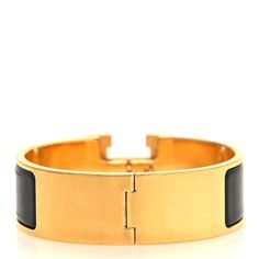 This is an authentic HERMES Enamel Wide Clic Clac H Bracelet GM in Black. This chic cuff bracelet features a gold band with a black enamel inlay. The bracelet opens with a swivel Hermes "H" on the prominent side. H Bracelet, Hermes Bracelet, Hermes Jewelry, Gold Band, Black Enamel, Gold Bands, A Black, Cuff Bracelet, Cuff Bracelets