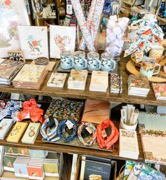 many cards and other items are on display in a store or craft shop, including greeting cards