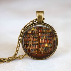 a book shelf with books and ladders on it is shown in this glass dome pendant