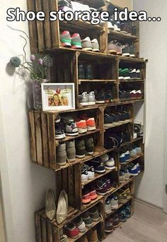 a wooden shoe rack filled with lots of shoes