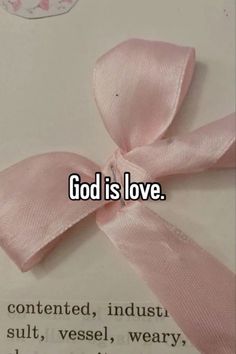 a pink bow with the words god is love