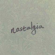 the word nostalgica written in cursive writing on a gray background