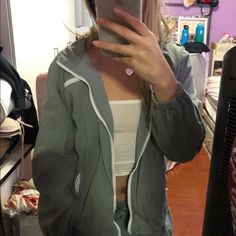 A Cotton Double Layered Jacket With Green And White Zip Closure Pockets On The Hips And Left Chest. 100% Cotton Measurements: 24" Length, 22" Bust Gray Long Sleeve Windbreaker For Spring, Nirvana Sweatshirt, Fur Lined Denim Jacket, Christy Hoodie, Brandy Melville Jacket, Oversized Zip Up Hoodie, Beige Jeans, Lined Denim Jacket, Oversized Denim Jacket