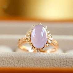 •Condition: Brand new•Center Stone: 5A+ Natural Purple Jade•Side Stone: Natural White Diamond (VS1 clarity and F color)•Ring Weight: 3g (depand the ring size)•Ring Dimension: approx 14.5*12.5*8mmEach piece is made-to-order with care and special attention to detail. all items are made with conflict-free diamonds and gems.The item will be gift wrapped and shipped.---------------------------------------------------------Available in :14k Rose or Yellow Gold, White Gold18k Rose or Yellow Gold, White Fine Jewelry Oval Cabochon Diamond Ring, Luxury Cabochon Diamond Ring As Gift, Luxury Rings With Oval Cabochon Accent Stones, Luxury Oval Cabochon Rings With Accent Stones, Oval Cabochon Diamond Ring In White Gold, Oval White Gold Diamond Ring With Cabochon, Elegant Oval Opal Ring With Gemstone Accents, Elegant Yellow Gold Amethyst Cabochon Ring, Elegant Yellow Gold Cabochon Amethyst Ring