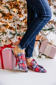 You have officially found the perfect holiday flat! That classic plaid print is so cute and we love that bow detail! We can't imagine a better pair of shoes for the holiday season! Run half a size small. Size up by a half size. Cam is wearing the 7. Actual product colors may vary from images shown due to different viewing devices and lighting. Warmest Wishes, Plaid Flats, White Floral Maxi Dress, Floral Cocktail Dress, Black Tie Dress, Long Sleeve Outerwear, Mint Julep Boutique, Flat Mules, Two Piece Swimwear