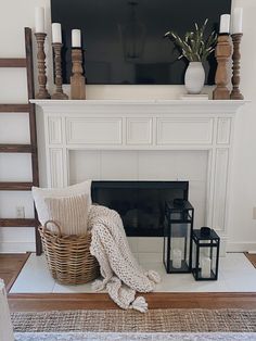 a living room with a fire place and a television on the mantel above it