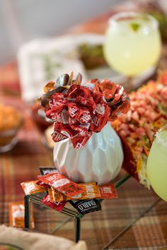 a table topped with lots of candy and drinks