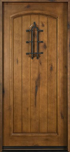 a wooden door with an iron handle on it