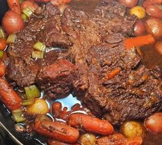 a pot roast with carrots, potatoes and meat