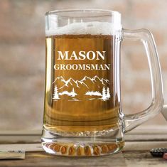 a beer mug sitting on top of a wooden table