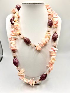 This vintage necklace is a stunning piece of art with beautiful pink rose quartz stones, shell and glass beads. It is a unique necklace that will complement any outfit. The multicolor beads are intricately designed to create a beaded necklace that is both stylish and charming. The necklace is perfect for women who love art and vintage jewelry. The necklace is made with high-quality materials and has a timeless appeal that will never go out of style. Beautiful Pink Roses, Pink Rose Quartz, Rose Quartz Stone, Unique Necklace, Wedding Jewellery Necklace, Quartz Rose, Glass Bead Necklace, Strand Necklace, Unique Necklaces