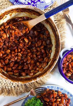 a bowl filled with beans and broccoli on top of a table