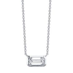 Sometimes simplicity is the most tasteful form of elegance. Set in fourteen karat white gold, this 1.29 carat emerald cut diamond pendant rests beautifully sitting east to west. Diamond - 1.29 Carats Chain Length - 16" Formal Emerald Cut Diamond Necklace, Classic Emerald Cut Necklace With Prong Setting, Classic Emerald Cut Emerald Necklace With Prong Setting, Classic White Gold Emerald Necklace, White Gold Emerald-cut Diamond Necklace, Classic Emerald Cut Diamond Emerald Necklace, Silver Emerald-cut Diamond Necklace With Prong Setting, Classic Emerald Cut Diamond Necklace, Emerald Cut Single Diamond Necklace