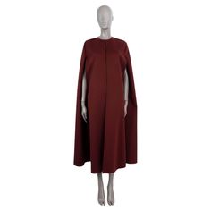 100% authentic Valentino maxi cape in burgundy wool (95%) and cashmere (5%). Features a sleek, collarless silhouette. Unlined. Has been worn and is in excellent condition. 2020 Resort Measurements Model TB3CG1N515E Tag Size 38 Size XS Shoulder Width 37cm (14.4in) Bust From 122cm (47.6in) Waist From 164cm (64in) Hips From 184cm (71.8in) Length 132cm (51.5in) All our listings include only the listed item unless otherwise specified in the description above Luxury Wool Cape For Women, Valentino Cape Dress, Valentino Cape Coat, Luxury Red Winter Cape, Luxury Red Long Wool Coat, Long Cape, Cape Jacket, Outerwear Coats, Cape