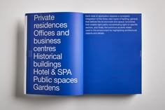 an open blue book with white lettering on the front and back cover, which reads private residencess and business historical buildings, hotel & spa public spaces gardens