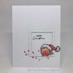 a white card with a bird on it's side and the words merry written in red