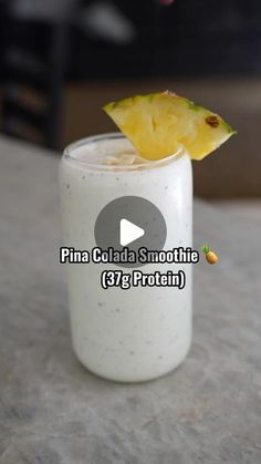 a pineapple on top of a smoothie in a glass with the text pina cola smoothie 377 protein