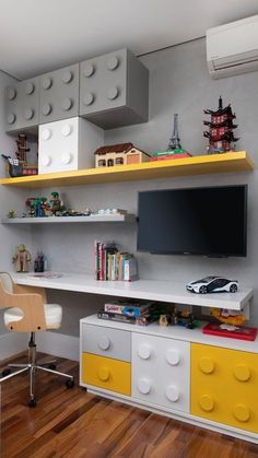 a toy car is on the shelf in front of the tv and bookshelf