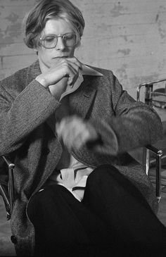 black and white photograph of a woman sitting in a chair