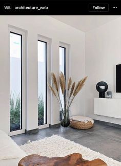 a living room filled with furniture and a flat screen tv