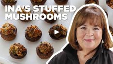 a woman standing in front of a plate with muffins on it and the words ina's stuffed mushrooms above her