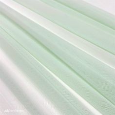 white fabric with light green lines on it