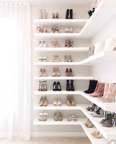 there are many pairs of shoes on the shelves